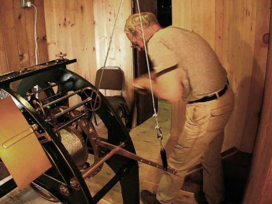 Stacey-winding-the-clock-and-chimes-for-the-bell